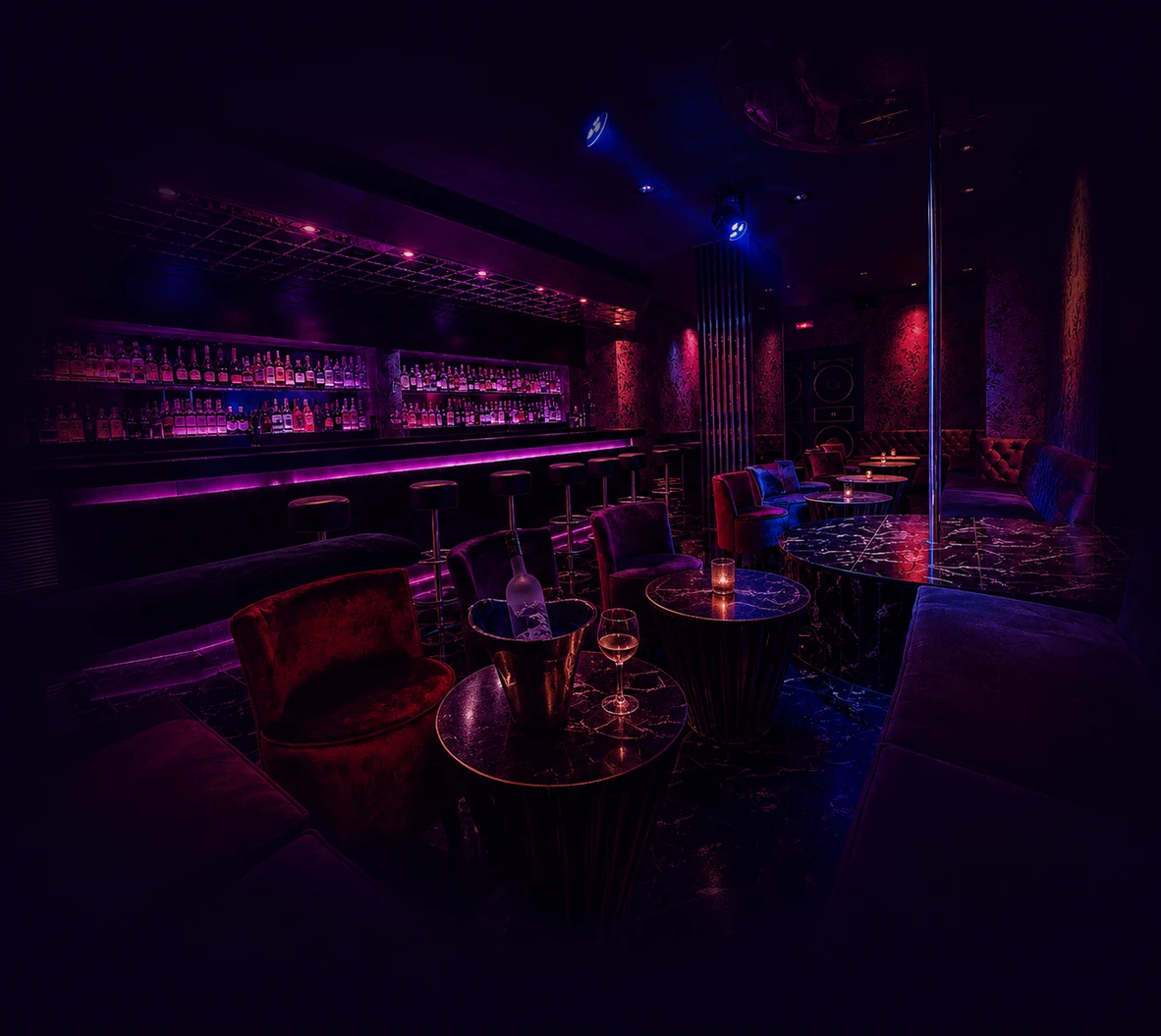 Darling Strip Club Barcelona lounge with dark purple and magenta nightlife lighting